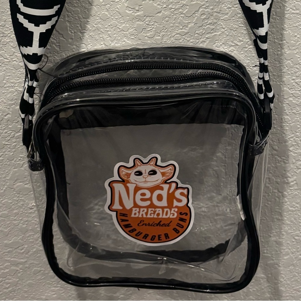 Small clear Twenty One Pilots themed crossbody bag with CLANCY strap